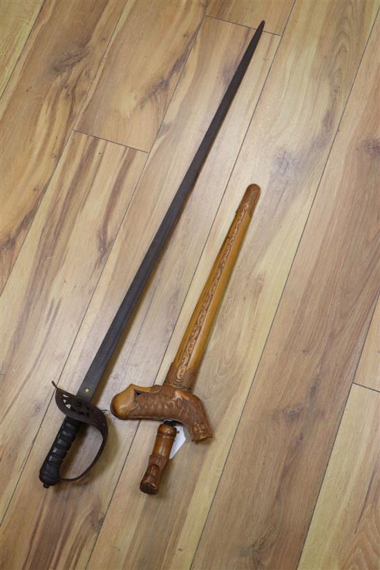 A Victorian military sword, 97cm and a 20th century kris, 58cm